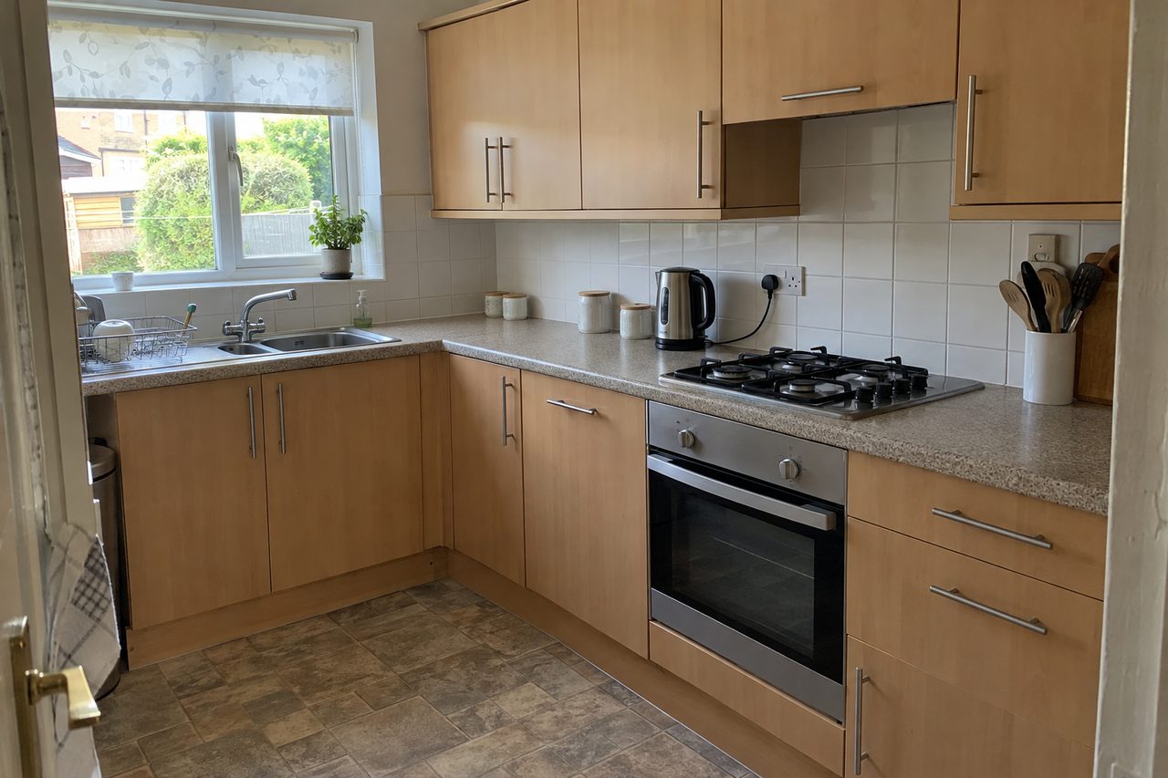 Example kitchen before the change, with wood-effect doors